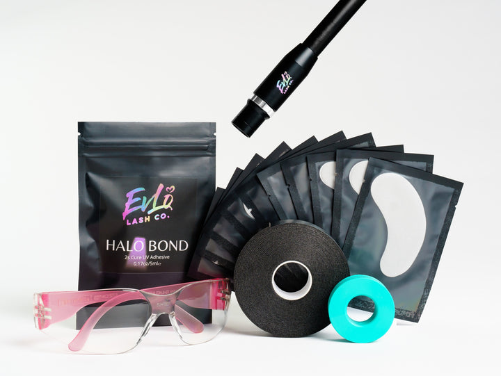 Halo Focus light: Halo Focus kit laid out: light head, Halo Bond pouch, gel tape roll, eye pads, pink eye protection